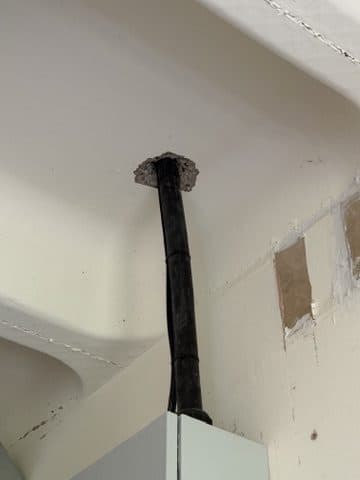 Ceiling penetration not made good.