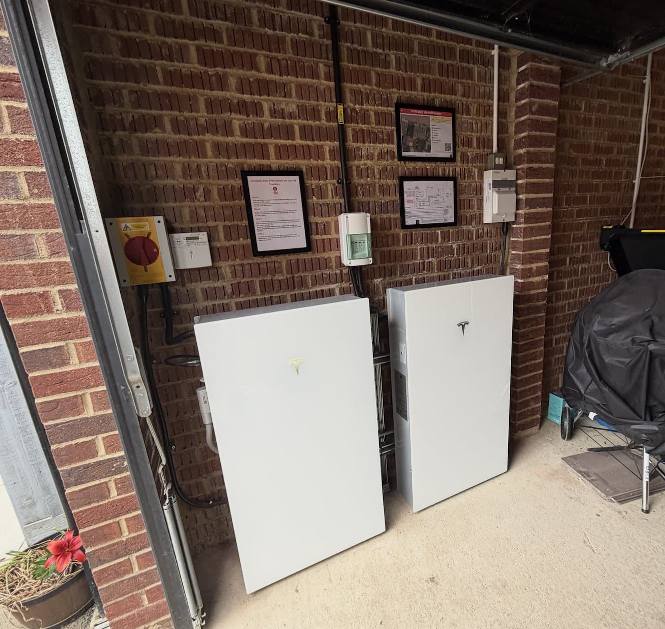 Twin Tesla Powerwall batteries in a garage