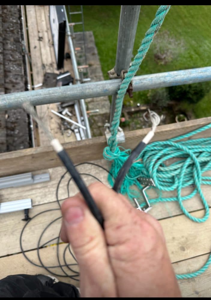 Unterminated DC cable with exposed conductors.
